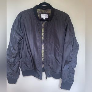 Xhilaration bomber jacket with camo lining and rouched arm detail